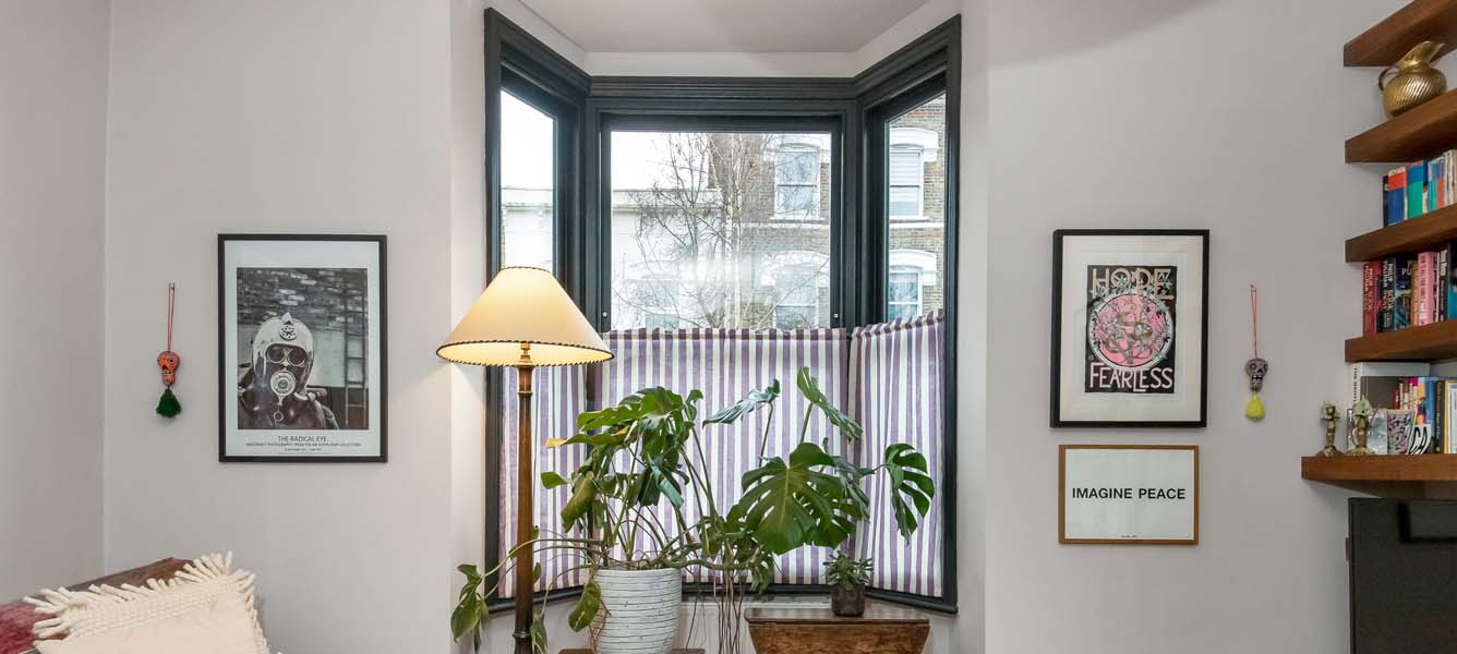 dark green sash window bay in living room